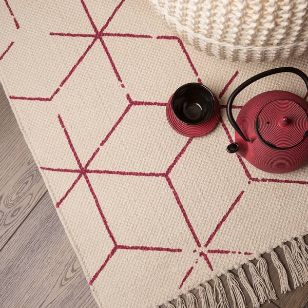 Detailaufnahme Designteppich mit Fransen in creme und pink von Heineking24